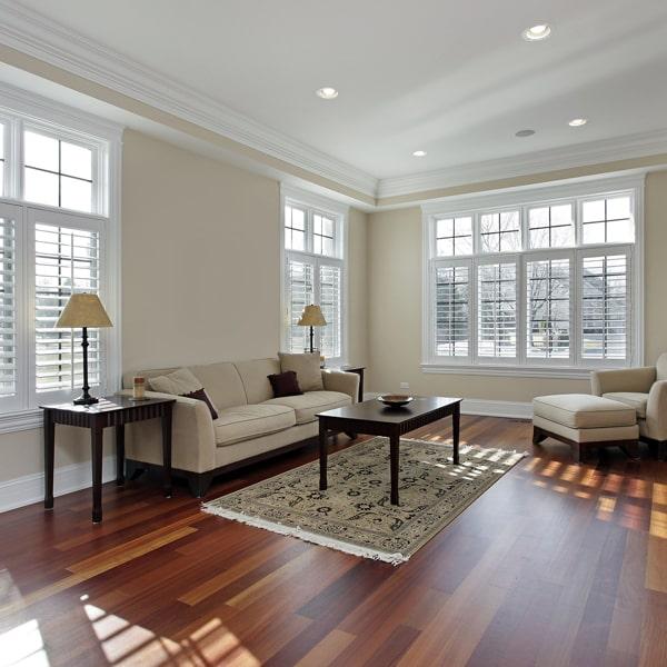 laminate floors are made from synthetic materials and is more cost-effective than hardwood flooring